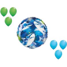 blue and green balloons with dolphins floating in the air next to them on a white background