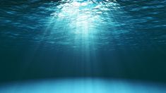 the sun is shining down on the ocean floor as it shines through the water