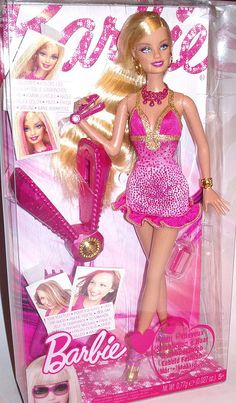 the barbie doll is wearing a pink dress and holding a pair of hairbrushes