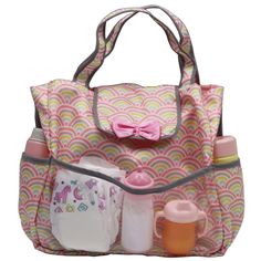 a baby bag with its contents in it and a pink bow on the top of it