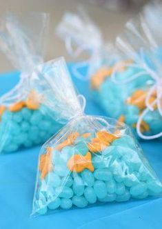 small bags filled with blue and yellow candies