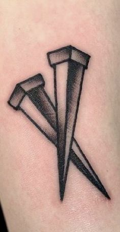 a black and white tattoo with three knives on the side of a woman's arm