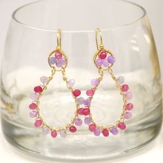 Delicate are our ELISA earrings, handcrafted with small jade gemstones in magenta and light purple tones wrapped in golden copper wire (wire description in materials). Purple and magenta tones add a delicate and cheerful touch to your formal or informal outfit. They are also perfect to give to bridesmaids or for that special holiday such as: Mother's Day, Birthday, Anniversary, Christmas or Valentine's Day. The accessories will reach your hands in a gift box and in a hard box so that it arrives Pink Teardrop Jewelry Beads For Crafting, Teardrop Pink Jewelry For Crafting, Pink Teardrop Beads For Jewelry Crafting, Pink Faceted Earrings For Gift, Pink Faceted Earrings For Jewelry Making, Pink Wire Wrapped Teardrop Earrings, Pink Gemstone Teardrop Earrings, Pink Teardrop Earrings With Natural Stones, Pink Briolette Earrings With Natural Stones