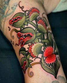 a close up of a person's arm with flowers on it