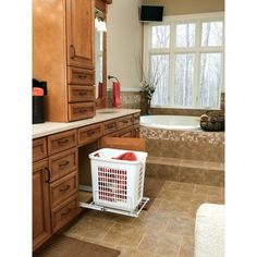 a bathroom with a tub, sink and large window