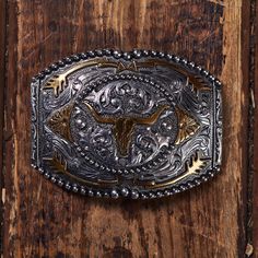 Product Details: Longhorn skull with arrows and western scrolls design Antique gold and silver 3" H x 4" W Partial beaded edge border Rectangle Fits belts up to 1 3/4" wide Zinc Longhorn Skull, Beaded Edge, Scroll Design, Gold And Silver, Antique Gold, Belts, Buckle, Silver, Gold