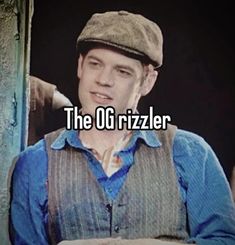 a man wearing a hat with the words the o g rizzler on it