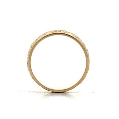 Enjoy the elegance of the past with this vintage Mid-Century unisex wedding band. Crafted in 14 karat yellow gold, this ring showcases a beautiful orange blossom engraving that adds a unique, artistic flair. At 6.5 mm wide, the band provides a comfortable fit while texture is enhanced by a high polish finish. The ridged edge detailing enhances its visual appeal with intricate texture. Whether paired with an engagement ring or worn alone, this beautiful ring is versatile and unique. Victorian Yellow Gold Etched Rings, Victorian Etched Yellow Gold Rings, Antique Etched Yellow Gold Rings, Antique Engraved Ring With Decorative Band For Anniversary, Vintage Wide Band Jewelry For Formal Occasions, Heirloom Rings With Decorative Band, Vintage Yellow Gold Engraved Promise Ring, Vintage Wide Band Yellow Gold Jewelry, Antique 14k Gold Etched Ring