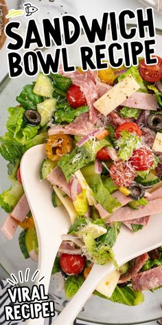 a salad with ham, lettuce and tomatoes on it