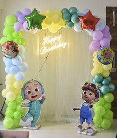 balloon arch with balloons and cartoon characters on it