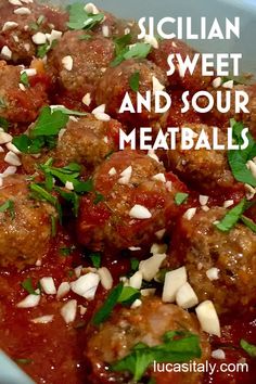 the meatballs are covered in sauce and garnished with parmesan cheese