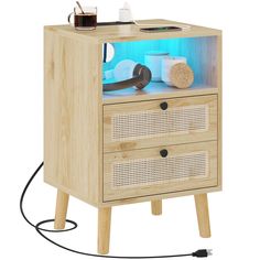 a wooden cabinet with two drawers and a phone on top, next to a cord