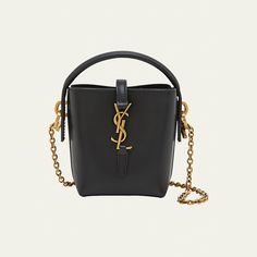 Saint Laurent "Le 37" bucket bag in calfskin leather  Top handle  Detachable chain crossbody strap, 19.2"L Can be worn as a top handle or crossbody bag  Open top with center YSL logo strap  Golden hardware  Approx. 5.3"H x 4.3"W x 1.9"D Made in Italy High-end Bucket Bag With Detachable Strap, Everyday Top Handle Bucket Bag With Chain Strap, Everyday Use Top Handle Bucket Bag With Chain Strap, Designer Bucket Bag With Chain Strap, Formal Rectangular Bucket Bag With Chain Strap, Evening Top Handle Bucket Bag With Chain Strap, Chic Bucket Bag With Chain Strap And Top Handle, Modern Evening Bucket Bag With Chain Strap, Evening Bucket Bag With Chain Strap And Top Handle