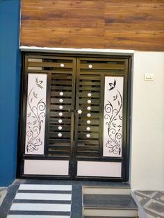 two doors with decorative designs on the outside