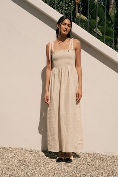 Be effortlessly chic in the Sophie Dress, a linen maxi dress with a smocked bodice for a perfect fit. Tie straps add a playful touch. Made from breathable linen for ultimate comfort. Vietnam Tailor, Linen Maxi Dress, Linen Clothes, Sustainable Clothing, Strap Dress, British Indian, Linen Dress, Lifestyle Brand, Lifestyle Brands