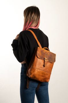 This backpack is produced in our workshop and it's %100 handmade. The handcrafted goods you use are produced from %100 authentic calf leather for you with specific care. Calf Leather can have a wrinkled, veined and pored appearance due to its natural features. There might be some changes in the color tone and texture details of the leather depending on the utilization. You can use this bag for a long time with this material. We wish you enjoy with it! Vintage Backpack For On-the-go, Vintage Everyday Backpack With Leather Backing, Vintage Leather Everyday Backpack, Vintage Style On-the-go Backpack, Everyday Vintage Backpack With Leather Handles, Waxed Leather Satchel Backpack, Everyday Vintage Satchel Backpack, Vintage Backpack With Leather Lining For Everyday Use, Waxed Leather Satchel Backpack For Daily Use