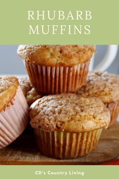 some muffins sitting on top of a cutting board with the title rhubarb muffins cd's country living