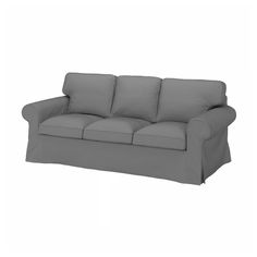 a gray couch sitting on top of a white floor