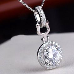 "Item Comes Without Chain. Specification:- Stone Details :- * Diamond Material : Cubic Zirconia (CZ)  & Moissanite ( As Per Order ) * Diamond Shape : Round Cut * Total Diamond Weight : 2.32 CT (Approx.) * Center Diamond Dimension : 8.00 MM * Center Diamond Weight : 2.00 CT * Side Diamond Dimension : 1.20, 2.00 MM * Side Diamond Weight : 0.32 CT * Diamond Color : White  * Diamond Clarity : VVS * Certificate : AGL ASIA (ONLINE) * Making Process: Handmade by our Experienced Staff. * Stamp: Our All Diamond White Moissanite Bridal Necklace With Round Shape, Diamond White Moissanite Bridal Necklace, Diamond White Round Cut Bridal Necklace Gift, Crystal Bridal Necklace With Round Cut, Sparkling Diamond Bridal Necklace Gift, Cubic Zirconia Necklace With Round Stone For Wedding, Wedding Necklace With Cubic Zirconia Round Stone, White Gold Crystal Bridal Necklace, Crystal Round Bridal Necklace For Anniversary