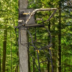 a tree stand with a chair attached to it