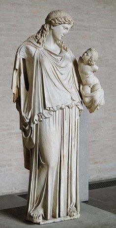 a statue of a woman holding a baby