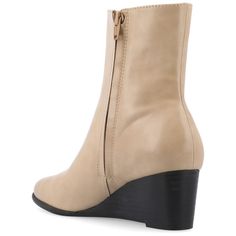 The Kylo booties from Journee Collection are a must-have for your wardrobe. These booties are made of high-quality vegan leather and have a luxurious feel. The stacked wedge heel adds a touch of style to its design. The side gore stretch ensures a comfortable fit, while the inside zip makes them easy to slip on. With a soft square toe, a 4 mm Tru Comfort Foam™ insole, and a 1-1/2-inch top circumference, these booties strike the perfect balance between comfort and trendiness. Wide Calf Faux Leather Ankle Boots, Beige Ankle-high Boots With Zipper Closure, Spring Wedge Ankle Boots Medium Width, Wide Calf Ankle-high Faux Leather Boots, Spring High Ankle Faux Leather Booties, Wide Calf Ankle-high Faux Leather Heeled Boots, Wide Calf Faux Leather Ankle-high Heeled Boots, Spring Faux Leather Ankle Boot Wedge Boots, Spring Faux Leather Ankle Boots