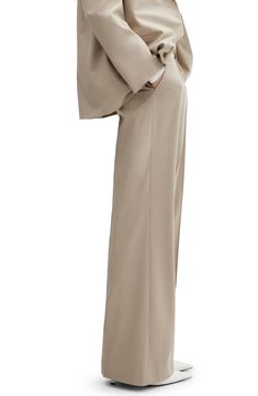 Crisp front pleats accentuate the classic style of wide-leg pants that play a key role in your office wardrobe. Zip fly with hook-and-bar closure Front slant pockets Partially lined 48% viscose, 47% polyester, 5% elastane Machine wash, line dry Imported Beige Formal Pantsuit With Straight Pants, Beige Straight Pantsuit For Formal Occasions, Beige Formal Pantsuit With Pockets, Formal Beige Pantsuit With Straight Pants, Elegant Career Trousers, Chic Tailored Wide Leg Pants For Office, Elegant Wide Leg Career Pants, Elegant Wide-leg Career Pants, Classic Beige Pantsuit For Work