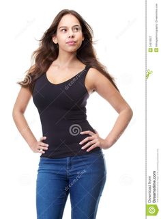 a beautiful young woman posing with her hands on her hips and looking at the camera