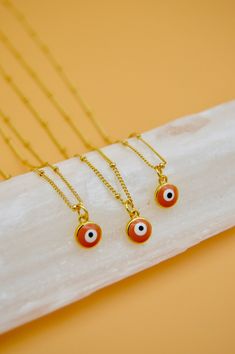 "Evil Eye Necklace, Gold Filled, Minimalist Jewelry, Protection Necklace The Cleo is a dainty gold filled satellite chain paired with an orange evil eye charm. The orange evil eye is said to bring you happiness and is said to increase the wearers playfulness and creativity. Layer up with other jewels or wear on its own for a cute, effortless look.  SIZE: 16\" inches + 3\" inch extender  MATERIALS: 18K Gold Filled  JEWELRY CARE Although gold filled will maintain its shine and resist tarnish, thes Minimalist Orange Necklace As Gift, Orange Evil Eye, Necklace Evil Eye, Evil Eye Necklace Gold, Car Charms Mirror, Protection Necklace, Heart Ornament, Evil Eye Charm, Evil Eye Necklace