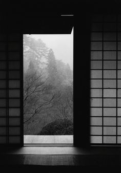 an open window with trees in the background