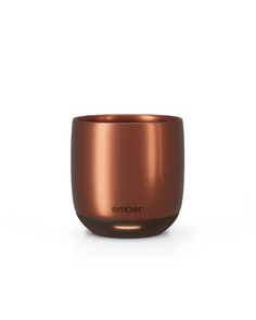 an empty copper cup with the word ember on it's front and side