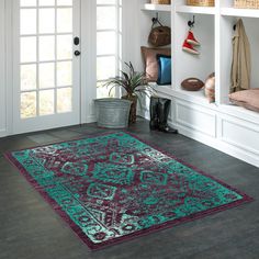 a large rug is in front of a white door