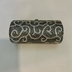 Christal Silver Evening Clutch Bag Made With Swarovski Crystals Small Tube Shape. Very Elegant. Fits In Your Hand. Just The Right Accent For A Special Event. Covered In Genuine, Very Fine, Small Sized Swarovski Crystals Comes With A Silver Strap. Can Be Worn As Shoulder Bag Or Clutch. Cell Phones Will Not Fit In This Purse. Approx. Measurements: 5" W X 2.75" H X 2.3" D (When Open) This Crystallized Purse Is Like A Piece Of Jewelry To Enhance And Complement Your Evening Look. Includes Silver Dust Elegant Fits, Evening Clutch Bag, Evening Clutch, Fit In, Special Event, Bag Making, Cell Phones, Special Events, Swarovski Crystals