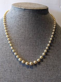 "Signed Faux Champagne 8mm Pearl Choker Necklace Single Strand Sterling Clasp High quality faux champagne pearl necklace with silk cording and hand knotted between pearls. Sterling silver push in clasp. Necklace will arrive gift boxed. * HALLMARKS Clasp is marked Sterling with a makers mark which I couldn't identify. * SIZE/MEASUREMENTS 22\" long with 8mm pearls * CONDITION In very good to excellent condition. Please use all the pictures as part of item's description. * MATERIALS Sterling Silver Classic Gold Pearl Necklace With 8mm Beads, Adjustable Beaded Pearl Necklace For Formal Occasions, Classic Adjustable Pearl Necklace For Party, Classic Single Strand Pearl Necklace For Evening, Classic Adjustable Pearl Necklace For Formal Occasions, Formal Single Strand Cream Pearl Necklace, Cream Pearl Necklace For Formal Occasions, Formal Cream Single Strand Pearl Necklace, Formal Cream Pearl Necklace