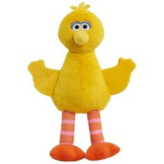 a yellow stuffed bird with pink and white striped socks on it's legs, standing upright