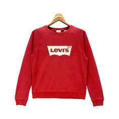 Brand Name :- Levis . 📌 Tag Size :- M . MEASUREMENT: -Follow the manual measurement provided. -Armpit to armpit - 20' Inches -Length - 22' Inches -Sleeve from neck - 28' Inches -Comparing the measurements with your own shirt are the best way before purchasing. -Please do not rely on tag size as pre-worn items. -They may have been altered, stretched or shrunk & vintage sizes do not directly translate the modern sizes. -Please enlarge the photos for clear image. . CONDITION: -USED CONDITION -NO F Red Crew Sweatshirt With Letter Print, Red Cotton Sweatshirt With Graphic Print, Red Cotton Graphic Print Sweatshirt, Retro Red Cotton Sweater, Red Crew Neck Sweatshirt With Graphic Print, Red Logo Print Sweatshirt For Fall, Red Casual Sweatshirt With Screen Print, Red Relaxed Fit Sweater With Letter Print, Fall Red Sweatshirt With Logo Print