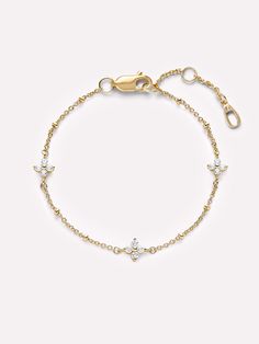 Introducing our dainty celestial bracelet that captures the essence of the stars. Dipped in lustrous 14K gold and adorned with three star-studded gems, this bracelet is an everyday piece that stands out effortlessly. Elevate your style by pairing it with our star hoop earrings for a gentle and elegant combination. • Dipped in 14K Gold • Celestial-style Cubic Zirconia stones • Comes with a 2 year warranty Lucy Star, Celestial Bracelet, Star Hoop Earrings, Detailed Jewelry, Jewelry Fashion Trends, Star Bracelet, Jewelry Lookbook, Pretty Bracelets, Dainty Bracelets