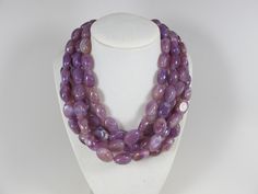 "Chunky amethyst statement necklace, multi strand statement purple necklace, beaded necklace, big violet beads, amethyst statement jewelry, matching earrings, BEST SELLER Spring 2018 Fashion A bold and dramatic statement necklace featuring acrylic amethyst nugget beads. 5 strands, light weight. Silver plated lobster clasp. Measurements: 16\" (43 cm) plus 3 1/2\" extender. Each piece of jewelry from my shop comes beautifully packaged in box and ready for gift giving. Thank you for shopping at my Purple Oval Beaded Necklaces For Jewelry Making, Unique Purple Gemstone Bead Necklaces, Purple Oval Faceted Bead Necklaces, Purple Necklaces With Faceted Oval Beads, Purple Oval Beaded Necklace, Handmade Multi-strand Purple Jewelry, Handmade Purple Multi-strand Jewelry, Purple Jewelry With Polished Oval Beads, Elegant Purple Necklace With Large Beads