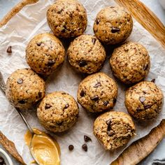 chocolate chip muffins on parchment paper with spoon