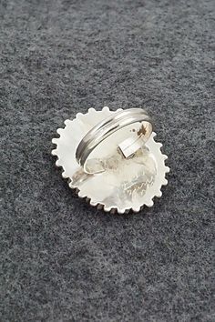 This coral and sterling silver ring was made by Zuni silversmith Shirley Lahri. The back is signed S. Lahi and Zuni, NM.Size: 7.5Length: 1 1/4"Width: 1"Free shipping on all orders! We ship with USPS and always include tracking. All orders ship within a day of payment.Returns are accepted up to 30 days after you receive your order. Just send us a message. Our shop offers cash back or store credit. The item must be returned in new condition. Elegant Untreated Silver Turquoise Ring, Handmade Silver Turquoise Ring For Formal Occasions, Formal Hallmarked Silver Turquoise Ring, Multicolor Southwestern Sterling Silver Turquoise Ring, Silver Turquoise Ring Hallmarked, Sterling Silver Multi-stone Turquoise Ring, Southwestern Hand-strung Sterling Silver Jewelry, Southwestern Style Nickel-free Sterling Silver Rings, Sterling Silver Multi-stone Turquoise Ring Gift