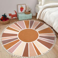 a large round rug on the floor in a child's bedroom