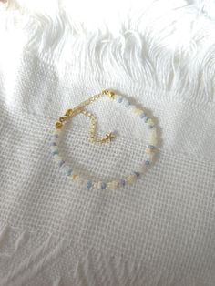 FOR OTHER DAINTY BEADED BRACELETS: https://www.etsy.com/ca/shop/ArtiChouXCanada?ref=seller-platform-mcnav§ion_id=46088511 Bracelet Length: 13-18cm (5.1-7 inches) with a 14k gold filled extender. This bracelet features an array of summer themed pastel colors: blue, white, cream, and light purple Japanese seed beads.  Thread may be visible since it is a handmade product   SIZING  Wrap a soft measuring tape snugly around the widest part of your wrist. Add 1.27cm (0.5in) to that measurement to deter Coastal Beaded Bracelets, Dainty Jewelry Gold, Adjustable Beaded Bracelet, Dainty Gold Jewelry, Bracelets Patterns, Diy Bracelet Designs, Diy Bracelets Patterns, Bead Ideas, Seed Bead Bracelets