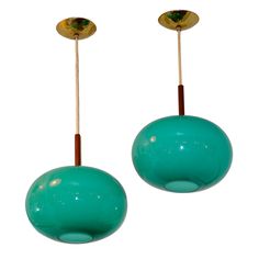 pair of turquoise glass and brass pendants