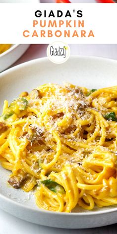 a white plate topped with pasta covered in sauce