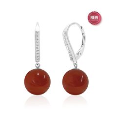 Unleash the fiery allure of our sterling silver carnelian earrings, the perfect 17th Anniversary jewelry gift for women. Featuring AAA quality 10 mm round dark orange gemstone spheres dangling from cubic zirconia accented lever backs. More than just an accessory, these beauties are imbued with the vibrant energy of the carnelian gemstone, known for its association with passion, creativity, and confidence. STYLE TIP: Pair with matching pendant necklace (priced separately) to complete the look PRODUCT INFORMATION -  METAL: Sterling Silver (Plated with rhodium for shine, durability and a tarnish resistant finish) -  LENGTH: 1.1 Inches / 28 mm -  WIDTH - 0.4 Inch / 10 mm -  DROP LENGTH - 1 Inch / 25 mm -  BACKING - Lever Back GEMSTONE -  TYPE: Carnelian -  SHAPE - Round Sphere -  CREATION - Na Red Polished Earrings For Gift, Elegant Carnelian Earrings, Elegant Carnelian Drop Earrings, Round Carnelian Earrings, Elegant Round Carnelian Jewelry, Elegant Orange Earrings For Formal Occasions, Red Round Earrings With Polished Finish, Elegant Red Earrings With Polished Finish, Elegant Carnelian Jewelry For Formal Occasions