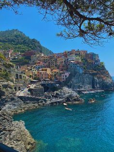 the town is perched on top of a cliff overlooking the ocean