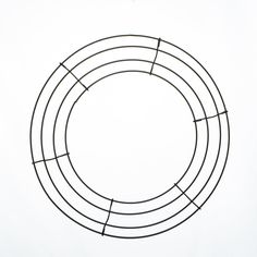 a circular wire sculpture on a white background