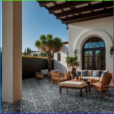 an outdoor patio with furniture and potted plants