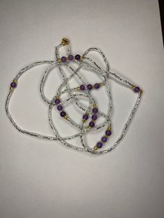 𝙸 𝙰𝚖 𝙰 𝙶𝚘𝚍𝚍𝚎𝚜𝚜. This waist bead is made with crystal seed beads, 6mm Amethyst round beads and gold glass beads. Amethyst is great beginner's stone. It is great for healing and protection. Put it under your pillow for more Vivid dreams. It also balances the crown chakra. Made with premium stretch cord or nylon string Please leave waist size in the personalization section at checkout. You can choose your finish. Choose tie or add a clasp for $3. If you add a clasp,please include waist s Silver Crystal Necklaces With Gemstone Beads, Spiritual Beaded Rondelle Crystal Necklace, Healing Silver Gemstone Beaded Necklaces, Silver Beaded Necklace For Healing, Silver Gemstone Beaded Necklaces For Healing, Silver Gemstone Beads Necklace For Healing, Spiritual Purple Jewelry With Tiny Beads, Purple Beaded Spiritual Crystal Necklaces, Crystal Beaded Necklaces With Silver Beads As A Gift