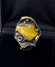 Artisan Baltic Amber RingHand-made Sterling Silver, 24k Gold, size 12Stones used: Baltic Amber, AmethystFace of the ring:  Height – 40mm, Width-30mm                                       Height – 1 1/2”, Width-1 1/4”                            Band height - 8mmUnique Handcrafted One-of a-kind Design RingEach Piece of Jewelry in my Collection is Absolutely One of a Kind!When you start wearing a piece of my jewelry you will fall in love with it more and more each day and feel that good Energy and Collectible Gold Opal Ring With Gemstone, Collectible Gold Opal Gemstone Ring, Handmade Yellow Gold Gemstones Fine Jewelry, Handmade Yellow Gold Fine Jewelry Gemstones, Handmade Yellow Gold Fine Gemstones, Fusion Style Yellow Gold Gemstones For Gift, Unique Yellow Gold Sterling Silver Gemstones, Handmade Yellow Gold Gemstones For Anniversary, Luxury Yellow Rings For Collectors